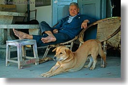asia, dogs, horizontal, laos, luang prabang, men, people, reclining, stretching, photograph