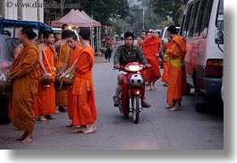 among, asia, asian, colors, horizontal, laos, luang prabang, men, monks, motorcycles, oranges, people, photograph