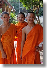 asia, asian, boys, colors, laos, luang prabang, men, monks, oranges, people, portraits, threes, vertical, photograph