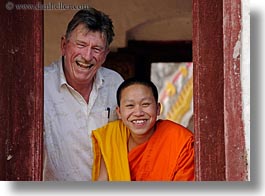 asia, asian, colors, horizontal, laos, luang prabang, men, monks, oranges, people, tourists, windows, photograph