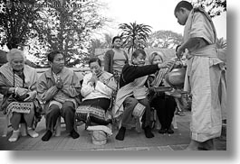 alms, asia, asian, black and white, colors, giving, giving alms, horizontal, laos, luang prabang, men, monks, oranges, people, procession, photograph