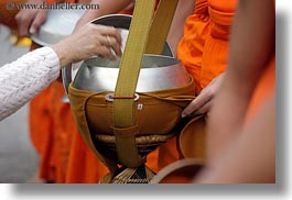 alms, asia, asian, colors, giving, giving alms, horizontal, laos, luang prabang, men, monks, oranges, people, procession, womens, photograph