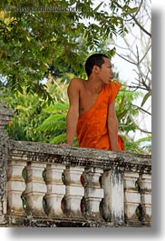 asia, asian, balconies, colors, gazing, laos, luang prabang, men, monks, off, oranges, people, singles, vertical, photograph