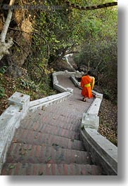 asia, asian, colors, down, laos, long, luang prabang, men, monks, oranges, people, singles, stairs, vertical, walking, photograph