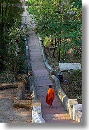 asia, asian, colors, down, laos, long, luang prabang, men, monks, oranges, people, singles, stairs, vertical, walking, photograph