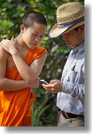 asia, asian, cellphone, colors, laos, luang prabang, men, monks, oranges, people, singles, tour guides, vertical, photograph