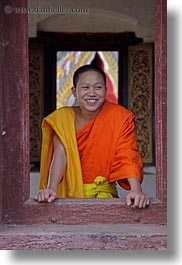 asia, asian, colors, laos, luang prabang, men, monks, oranges, people, singles, vertical, windows, photograph