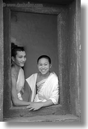 asia, asian, black and white, colors, laos, luang prabang, men, monks, oranges, people, two, vertical, windows, photograph