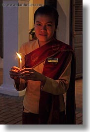 asia, asian, candles, emotions, glow, holding, laos, lights, luang prabang, nite, people, smiles, vertical, womens, photograph