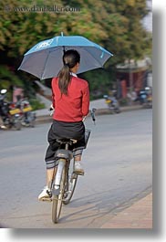 asia, bicycles, laos, luang prabang, people, umbrellas, vertical, womens, photograph