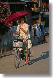 asia, asian, bicycles, laos, luang prabang, people, umbrellas, vertical, womens, photograph