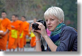 asia, asian, cameras, colors, horizontal, laos, luang prabang, men, monks, oranges, people, photographing, womens, photograph