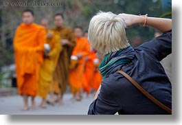 asia, asian, colors, horizontal, laos, luang prabang, men, monks, oranges, people, photographing, womens, photograph