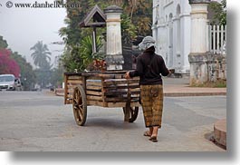 asia, carts, horizontal, laos, luang prabang, people, pushing, womens, woods, photograph