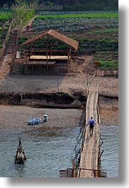 agriculture, asia, bamboo, bridge, buildings, crossing, huts, laos, luang prabang, materials, men, nature, rivers, scenics, structures, vertical, water, photograph
