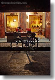 asia, bicycles, bikes, fronts, laos, luang prabang, nite, stores, transportation, vertical, photograph