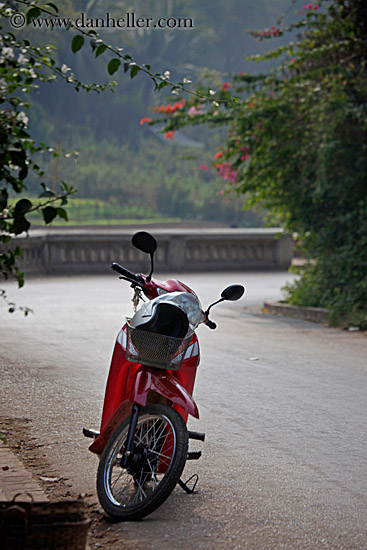 red-motorcycle-on-street-alone.jpg