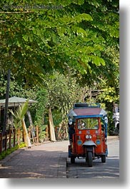 asia, cars, laos, luang prabang, transportation, trees, tuk tuk, under, vertical, photograph