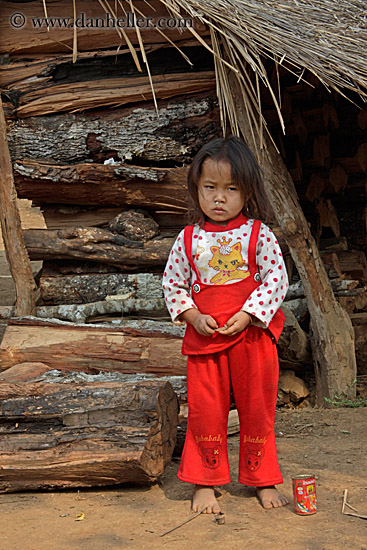 girl-in-red-by-wood-hut.jpg