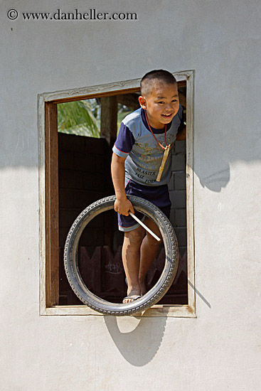 boy-in-window-w-tire.jpg