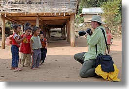 asia, asian, cameras, clothes, emotions, groups, hats, horizontal, laos, laugh, men, people, photographing, river village, smiles, toddlers, tourists, villages, photograph