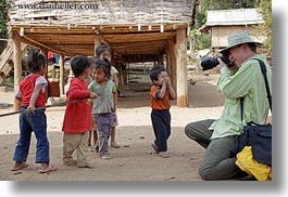 asia, asian, cameras, clothes, emotions, groups, hats, horizontal, laos, laugh, men, people, photographing, river village, smiles, toddlers, tourists, villages, photograph