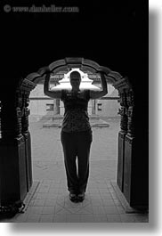 archways, asia, black and white, kathmandu, museums, nepal, silhouettes, under, vertical, womens, photograph