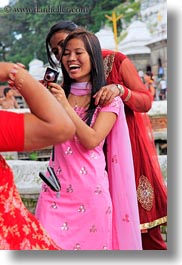 asia, emotions, friends, girls, kathmandu, nepal, pashupatinath, people, photographing, smiles, teenagers, vertical, womens, photograph