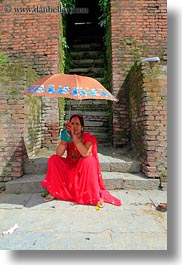 asia, bindi, earrings, hindu, jewelry, kathmandu, nepal, pashupatinath, religious, sindoor, stud, tikka, umbrellas, vertical, womens, photograph