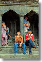 asia, eating, ice cream, kathmandu, men, nepal, patan darbur square, vertical, photograph