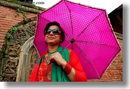 asia, emotions, guides, horizontal, kathmandu, nepal, patan darbur square, smiles, tours, umbrellas, womens, photograph
