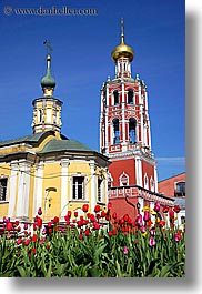 asia, bell towers, buildings, churches, crosses, flowers, monestaries, moscow, nature, onion dome, red, religious, russia, structures, tulips, vertical, yellow, photograph