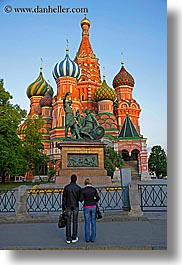 arts, asia, bronze, buildings, churches, colorful, colors, couples, dmitry, kuzma, landmarks, materials, minin, moscow, onion dome, people, pokrovskiy, pozharsky, religious, russia, st basil cathedral, st. basil, statues, structures, vertical, photograph