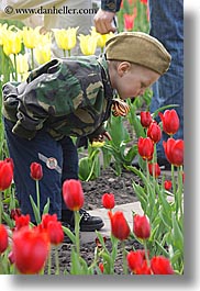 asia, beret, boys, childrens, clothes, colors, flowers, hats, moscow, nature, people, red, russia, tulips, vertical, photograph
