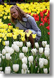 asia, blonds, colors, emotions, happy, moscow, people, posing, red, russia, smiles, tulips, vertical, womens, yellow, photograph