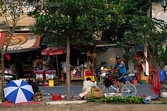 man-on-bike-by-vendors.jpg