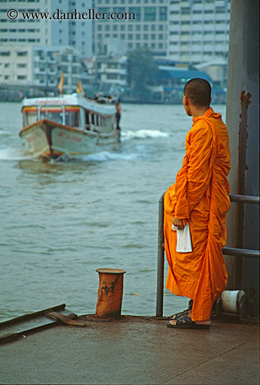 monk-looking-at-river-boat.jpg