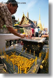 asia, bangkok, incense, lighting, men, thailand, vertical, wat phra kaew, photograph