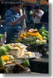 asia, bangkok, flowers, people, praying, thailand, vertical, wat phra kaew, photograph