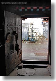 asia, asian, bicycles, colors, doors, doorways, lhasa, red, style, tibet, vertical, photograph