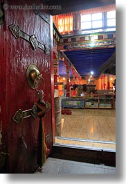 asia, doors, ganden monastery, glow, lhasa, lights, ornate, paint, red, tibet, vertical, photograph