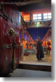 asia, doors, ganden monastery, glow, lhasa, lights, monks, ornate, tibet, vertical, photograph