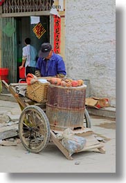 asia, lhasa, men, people, streets, tibet, vendors, vertical, photograph