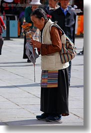 asia, buddhist, lhasa, old, people, praying, religious, tibet, vertical, womens, photograph