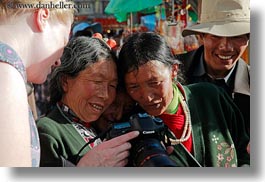 asia, cameras, emotions, horizontal, lhasa, looking, people, smiles, tibet, tibetan, womens, photograph