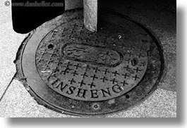 asia, black and white, covers, horizontal, lhasa, manholes, streets, tibet, xinsheng, photograph