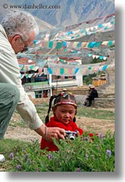 asia, cameras, girls, lhasa, looking, tibet, vertical, villages, photograph