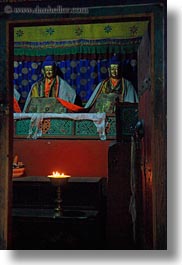 asia, asian, buddhas, buddhist symbols, candles, glow, lights, style, tan druk temple, tibet, vertical, photograph