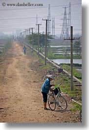 asia, bicycles, bikes, ha long bay, vertical, vietnam, wires, womens, photograph