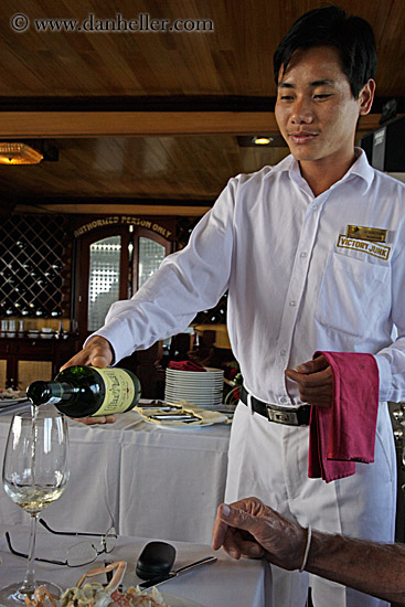 man-serving-white-wine-2.jpg